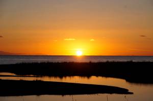 The great pumpkin The sun sets over the Aleutian Range and is reflected in Mariner Park Lagoon on Monday, Oct. 29, 2018, in Homer, Alaska. (Photo by Michael Armstrong/Homer News)