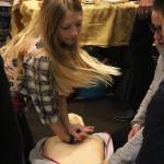 Maddox Berg, 14, practices performing CPR with the help of Homer Volunteer Fire Departments Donna McNulty during the annual Rotary Health Fair on Saturday, Nov. 3, 2018 at Homer High School in Homer, Alaska. (Photo by Megan Pacer/Homer News)