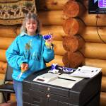 Election official Jolayne Soplanda mans the ballot box and rewards voters with I Voted stickers at the Anchor Point Senior Center during the midterm elections on Tuesday, Nov. 6, 2018, in Anchor Point, Alaska. (Photo by Delcenia Cosman)