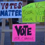 A set of signs at the corner of Pioneer Avenue and Heath Street takes a nonpartisan approach to the election on Nov. 6, 2018. (Photo by Michael Armstrong/Homer News)
