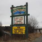 The Anchor River Inn sign overlooks the Sterling Highway on Nov. 10, 2018, in Anchor Point, Alaska, announcing that the business is under new management. (Photo by Delcenia Cosman)