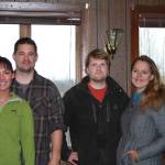 From left to right, new managers and upcoming owners Brittnay and Kyle Akee and Billy and Mamie Walker pose in the restaurant of the Anchor River Inn on Nov. 10, 2018 in Anchor Point, Alaska. (Photo by Delcenia Cosman)