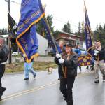 Members of veterans organizations march down Main Street in a Veterans Day parade Sunday, Nov. 11, 2018 in Homer, Alaska. (Photo by Megan Pacer/Homer News)