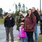 Onlookers welcome a parade of veterans to the Alaska Islands and Oceans Center for a ceremony after the parade held Sunday, Nov. 11, 2018 in Homer, Alaska. (Photo by Megan Pacer/Homer News)