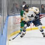 Homers Hunter Green tries to keep the puck away from Services Schyler Garrity during their game Thursday, Nov. 15, 2018 during the first night of the End of the Road Shootout at Kevin Bell Arena in Homer, Alaska. (Photo by Megan Pacer/Homer News)