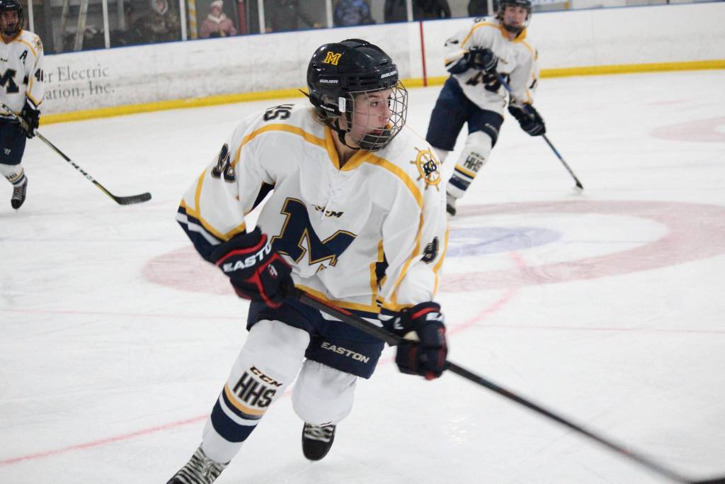 Homers Fiona Hatton looks up the ice during a game against Service High School during the first night of the End of the Road Shootout on Thursday, Nov. 15, 2018 at Kevin Bell Arena in Homer, Alaska. A freshman, Hatton scored her first goal Thursday and was awarded the game puck. (Photo by Megan Pacer/Homer News)