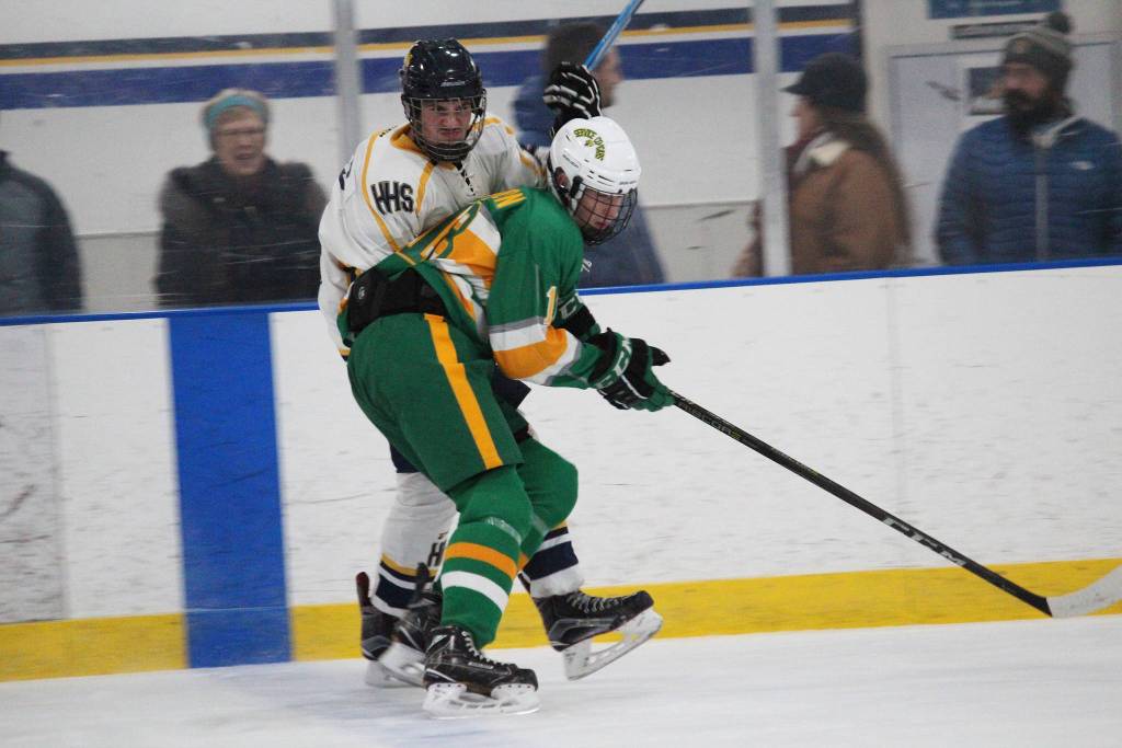 Service High School player Brent Edmonson keeps Homers Alden Ross at bay during a game between the two schools Thursday, Nov. 15, 2018 during the End of the Road Shootout at Kevin Bell Arena in Homer, Alaska. (Photo by Megan Pacer/Homer News)