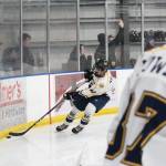 Homers Isaiah Nevak scoops the puck out of the corner during a game against Service High School on Thursday. Nov. 15, 2018 during the End of the Road Shootout at Kevin Bell Arena in Homer, Alaska. (Photo by Megan Pacer/Homer News)