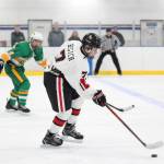 Kenais Jacob Begich takes the puck up the ice Saturday, Nov. 17, 2018 during a game against Service High School during the End of the Road Shootout at Kevin Bell Arena in Homer, Alaska. (Photo by Megan Pacer/Homer News)