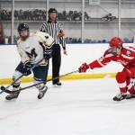 Homers Hunter Green looks for a place to put the puck while under pressure from Wasillas Hunter Parsons during the last game of the End of the Road Shootout on Saturday, Nov. 17, 2018 at Kevin Bell Arena in Homer, Alaska. (Photo by Megan Pacer/Homer News)