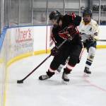Kenais ????? grabs the puck out of the corner with Homers Isaiah Nevak on his heels during a game Friday, Nov. 16, 2018 during the End of the Road Shootout at Kevin Bell Arena in Homer, Alaska. (Photo by Megan Pacer/Homer News)