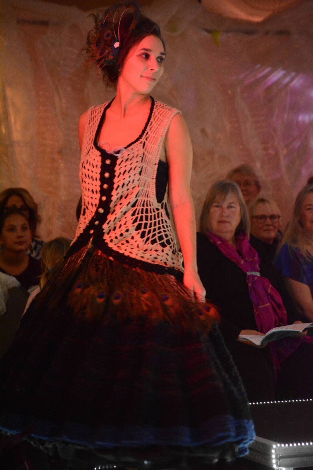 Rebeka Tufares models Feathers and Hoops by Lila Johnson at the 2018 Wearable Arts on Nov. 17, 2018, in Homer, Alaska. (Photo by Michael Armstrong/Homer News)