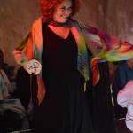 Katie Jo Gamble models Quilted Artists Travel Bag by Meriam Linder and scarves by Gail Baker at the 2018 Wearable Arts on Nov. 17, 2018, in Homer, Alaska. (Photo by Michael Armstrong/Homer News)