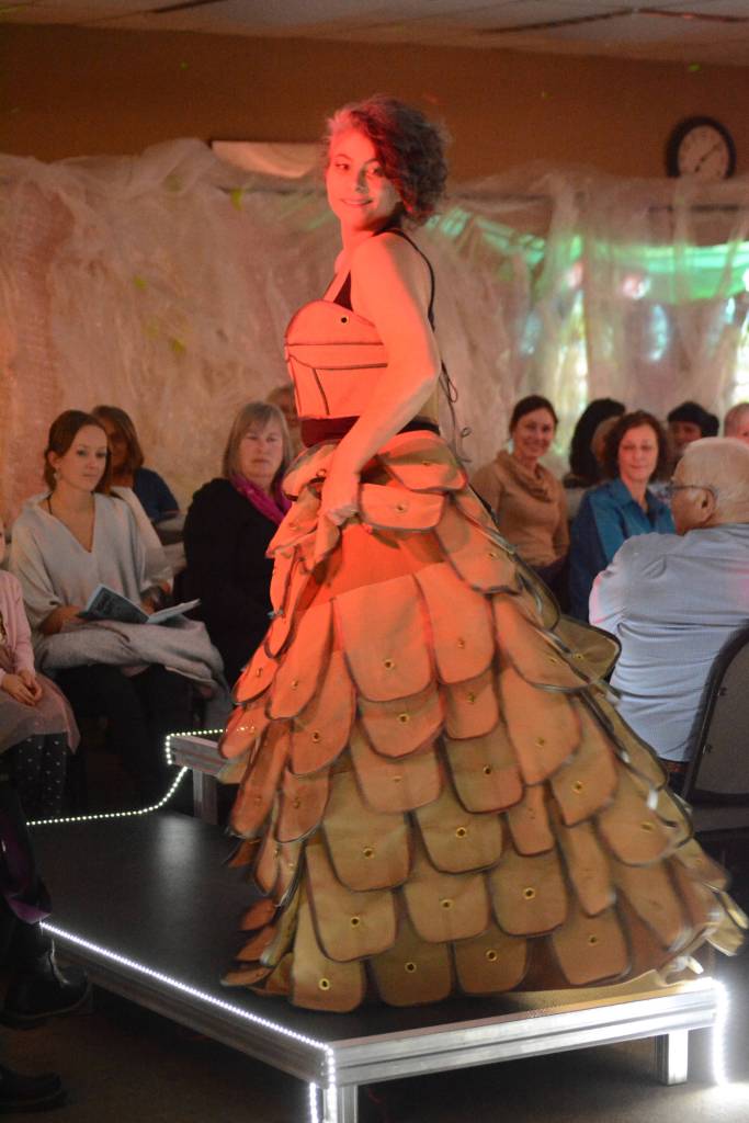 Christine Kulcheski models Brailer Dress by Cassie Brooks of NOMAR at the 2018 Wearable Arts on Nov. 17, 2018, in Homer, Alaska. (Photo by Michael Armstrong/Homer News)