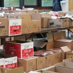Boxes of food and ingredients are organized by the Kachemak Bay Lions Club for their annual Thanksgiving baskets Sautrday, Nov. 17, 2018 at the Homer United Methodist Church in Homer, Alaska. (Photo by Megan Pacer/Homer News)