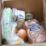 Ingredients wait to be enjoyed by one of the man families that benefit from the Thanksgiving baskets put together by the Kachemak Bay Lions Club, put together Saturday, Nov. 17, 2018 at the Homer United Methodist Church in Homer, Alaska. (Photo by Megan Pacer/Homer News)