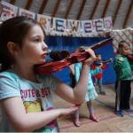 <span class="neFMT neFMT_PhotoCredit">Photo by Miranda Weiss</span>                                First grade student Elizabeth Parke practices holding a cardboard violin, in anticipation of the real thing, at Fireweed Academy in Homer.