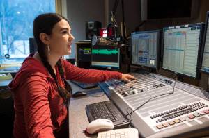Annie Bartholomew, Program Director and host for KXLL-FM, has helped find five songs from Alaska artists in the first round of nominees intended to replace the states existing telephone hold music. (Michael Penn | Juneau Empire)