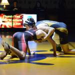 Homer High School Mariner Seth Inama, right, wrestles with Kenai High School Kardinal Daemon Duniphin, left, in a meet held Wednesday, Nov. 21, 2018, at the Homer High School Alice Witte Gym in Homer, Alaska. (Photo by Michael Armstrong/Homer News)