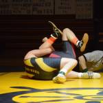 Homer High School Mariner Hunter Harrington, left, wrestles with Kenai High School Kardinal Thomas Mathis, right, in a meet held Wednesday, Nov. 21, 2018, at the Homer High School Alice Witte Gym in Homer, Alaska. (Photo by Michael Armstrong/Homer News)