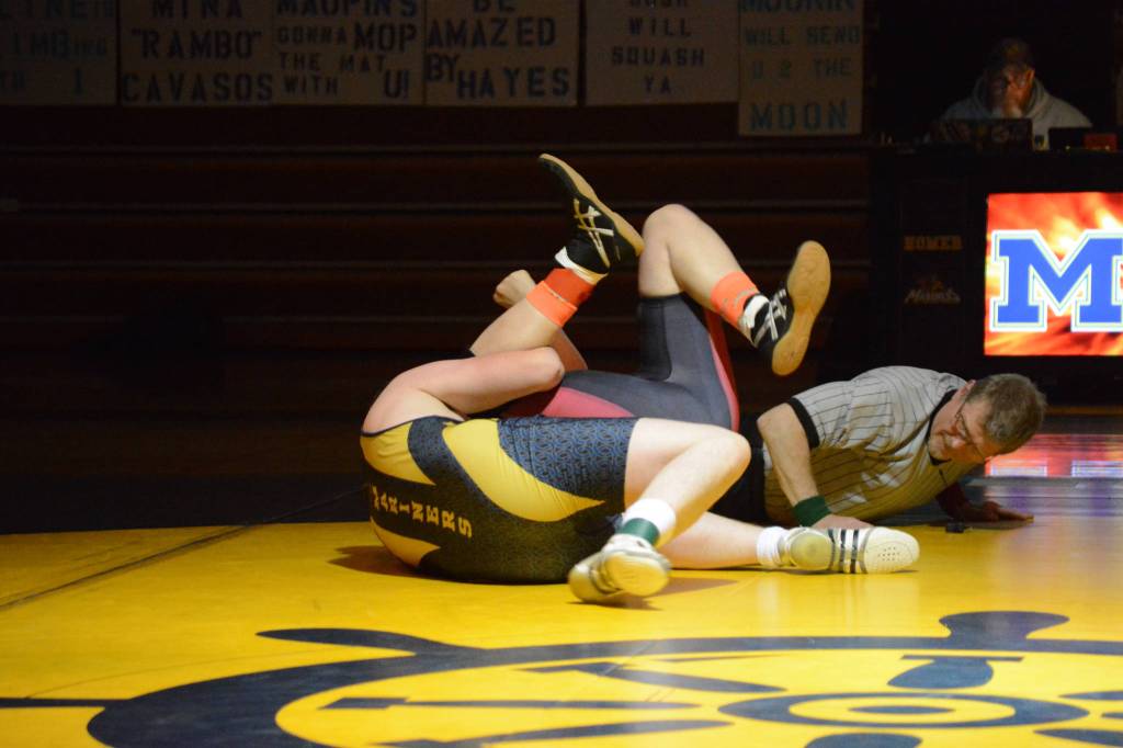 Homer High School Mariner Hunter Harrington, left, wrestles with Kenai High School Kardinal Thomas Mathis, right, in a meet held Wednesday, Nov. 21, 2018, at the Homer High School Alice Witte Gym in Homer, Alaska. (Photo by Michael Armstrong/Homer News)