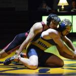Homer High School Mariner Mose Hayes, right, wrestles with Kenai High School Kardinal Brandon Koto, left, in a meet held Wednesday, Nov. 21, 2018, at the Homer High School Alice Witte Gym in Homer, Alaska. (Photo by Michael Armstrong/Homer News)                                Homer High School Mariner Mose Hayes, right, wrestles with Kenai High School Kardinal Brandon Koto, left, in a meet held Wednesday, Nov. 21, 2018, at the Homer High School Alice Witte Gym in Homer, Alaska. (Photo by Michael Armstrong/Homer News)