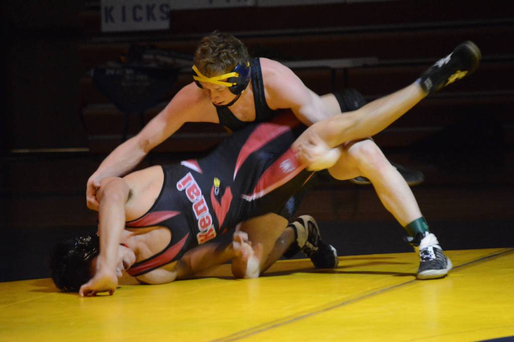 Homer High School Mariner Mose Hayes, right, wrestles with Kenai High School Kardinal Brandon Koto, left, in a meet held Wednesday, Nov. 21, 2018, at the Homer High School Alice Witte Gym in Homer, Alaska. (Photo by Michael Armstrong/Homer News)