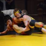 Homer High School Mariner Mose Hayes, right, wrestles with Kenai High School Kardinal Brandon Koto, left, in a meet held Wednesday, Nov. 21, 2018, at the Homer High School Alice Witte Gym in Homer, Alaska. (Photo by Michael Armstrong/Homer News)