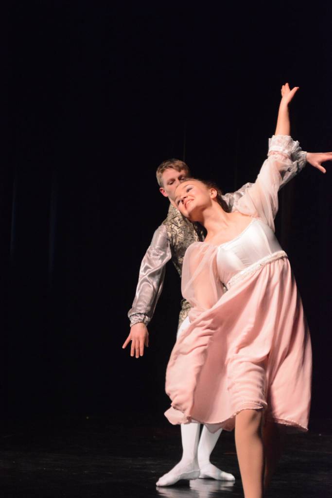 Collin Trummel, the Nutcracker Prince, left, and Aiyana Cline, right, as Clara, rehearse a scene from the Homer production of the Nutcracker Ballet on Nov. 25, 2018, at the Mariner Theatre in Homer, Alaska. (Photo by Michael Armstrong/Homer News)
