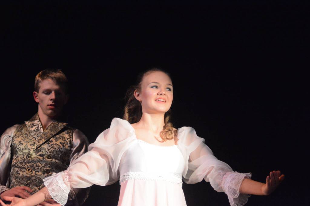 Collin Trummel, the Nutcracker Prince, left, and Aiyana Cline, right, as Clara, rehearse a scene from the Homer production of the Nutcracker Ballet on Nov. 25, 2018, at the Mariner Theatre in Homer, Alaska. (Photo by Michael Armstrong/Homer News)