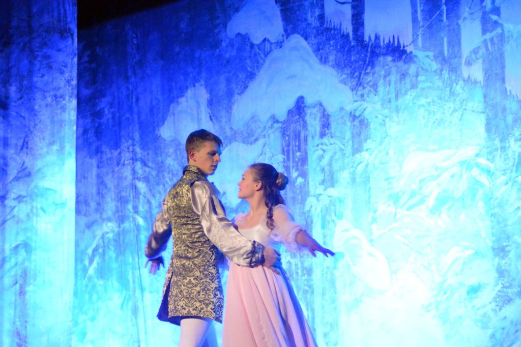 Collin Trummel, the Nutcracker Prince, left, and Aiyana Cline, right, as Clara, rehearse a scene from the Homer production of the Nutcracker Ballet on Nov. 25, 2018, at the Mariner Theatre in Homer, Alaska. (Photo by Michael Armstrong/Homer News)