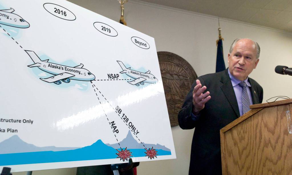 In this July 14, 2016 photo, Gov. Bill Walker points to a chart during a press conference that uses a crashing jet to show possible scenarios for Alaska economy if the legislature fails to act during its special session. (Michael Penn | Juneau Empire File)