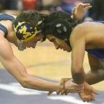 Homers Seth Inama and Soldotnas Ben Booth tangle at 125 pounds Tuesday, Nov. 27, 2018, at Soldotna Prep in Soldotna, Alaska. Inama would score a major decision. (Photo by Jeff Helminiak/Peninsula Clarion)