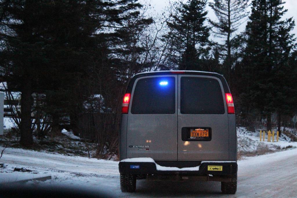 The vehicle of an emergency responder flashes its lights on Lake Shore Drive in Homer, Alaska, following a tsunami warning triggered by a 7.0 magnitude earthquake that struck 12 kilometers from Anchorage on Friday, Nov. 30, 2018. (Photo by Megan Pacer/Homer News)
