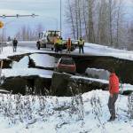 Highway workers and spectators look at Sulczynskis car stuck on a section of an off-ramp that collapsed during an earthquake Friday morning, Nov. 30, 2018 in Anchorage, Alaska. Sulczynski was not injured attempting to exit Minnesota Drive at International Airport Road. Back-to-back earthquakes measuring 7.0 and 5.8 rocked buildings and buckled roads Friday morning in Anchorage, prompting people to run from their offices or seek shelter under office desks, while a tsunami warning had some seeking higher ground. (Photo by Dan Joling/Associated Press)