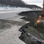 This photo provided by Chris Riekena shows excavation work being conducted Saturday, Dec. 1, 2018, near the Mirror Lake exit of the Glenn Highway near Eklutna, Alaska, to make the highway ready for repaving. The highway was heavily damaged in several spots following a magnitude 7.0 earthquake on Nov. 30, 2018. (Chris Riekena via AP)