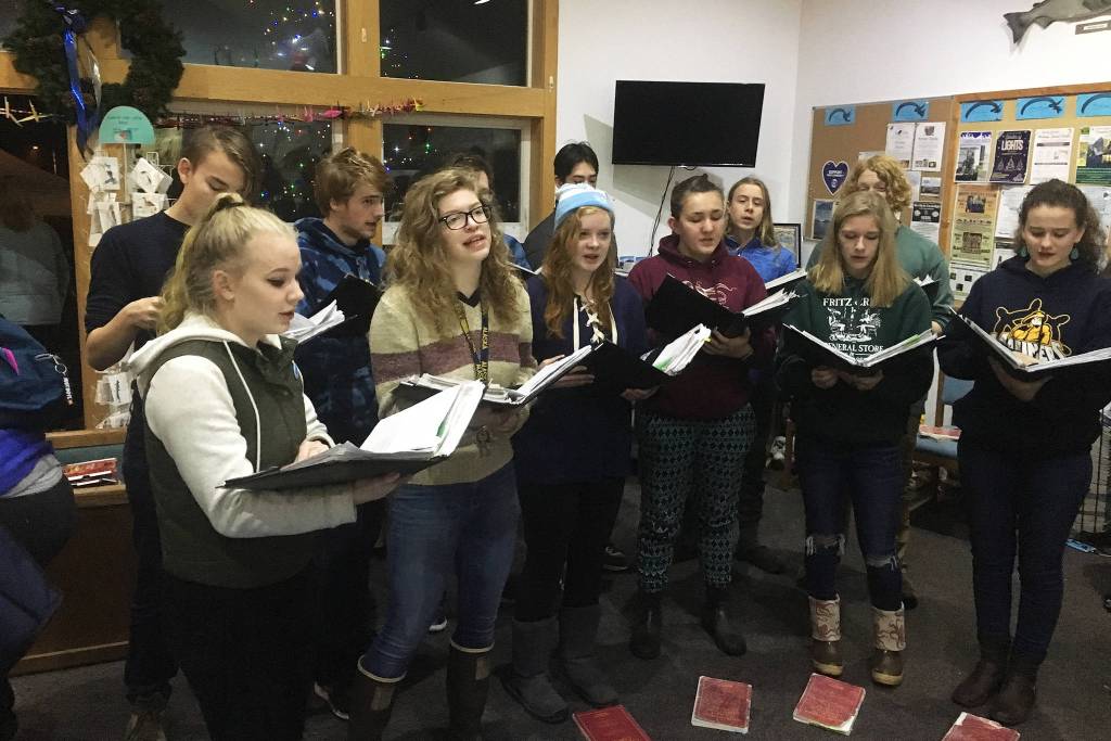 The Homer High School Swing Choir performs Friday, Nov. 30, 2018 at the Homer chamber of Commerce and Visitor Centers Holiday Tree Lighting event in Homer, Alaska. (Photo by Megan Pacer/Homer News)