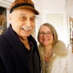 Jack Packer, left, and his daughter, Sharlene Cline, pose for a photo at the First Friday, Dec 7, 2018, opening of Bunnell Street Arts Centers 10x10 show in Homer, Alaska. Both had paintings in the show. (Photo by Michael Armstrong/Homer News)
