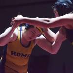 Homers Mariah Grimes (left) battles Redingtons Twyla Anderstrom for the girls 160-pound title Saturday, Dec. 8, 2018 at the Kachemak Conference wrestling tournament at Grace Christian High School in Anchorage, Alaska. (Photo by Joey Klecka/Peninsula Clarion)