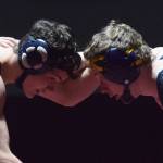 Homer teammates Josh Bradshaw (left) and Mose Hayes square off in the 152-pound championship Saturday, Dec. 8, 2018 at the Kachemak Conference wrestling tournament at Grace Christian High School in Anchorage, Alaska. (Photo by Joey Klecka/Peninsula Clarion)