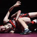 Kenai Central wrestler Talon Whicker fights against Nikiskis Griffin Gray on Saturday, Dec. 8, 2018 at the Kachemak Conference wrestling tournament at Grace Christian High School in Anchorage, Alaska. (Photo by Joey Klecka/Peninsula Clarion)