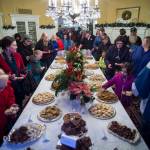 Juneau residents file through the dining room for cookies at the Governors Open House on Tuesday, Dec. 11, 2018. (Michael Penn | Juneau Empire)