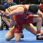 Homers McKenzie Cook battles against Eielsons Nailah Bealer (right) in the girls 145-pound final Saturday, Dec. 15, 2018 at the girls state wrestling championships at the Alaska Airlines Center in Anchorage, Alaska. (Photo by Joey Klecka/Peninsula Clarion)
