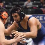 Soldotna senior Aaron Faletoi anticipates the moves of West Anchorages Kelton Mock in the 215-pound final Saturday, Dec. 15, 2018 at the Div. I state wrestling championships at the Alaska Airlines Center in Anchorage, Alaska. (Photo by Joey Klecka/Peninsula Clarion)