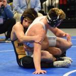 Homer senior Luciano Fasulo works on Dillinghams Chris Williams in the 135-pound final Saturday, Dec. 15, 2018 at the Div. II state wrestling championships at the Alaska Airlines Center in Anchorage, Alaska. (Photo by Joey Klecka/Peninsula Clarion)