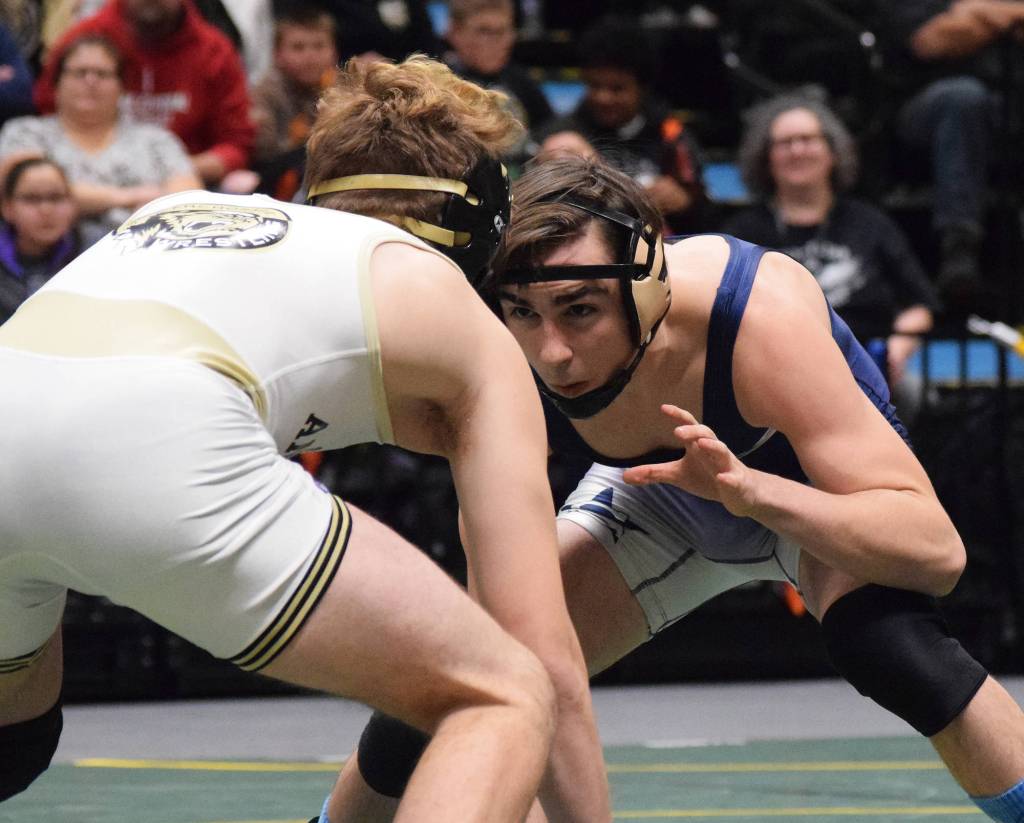 Soldotna senior Gideon Hutchison takes on Souths Jacob Shack in the 130-pound final Saturday, Dec. 15, 2018 at the Div. I state wrestling championships at the Alaska Airlines Center in Anchorage, Alaska. (Photo by Joey Klecka/Peninsula Clarion)