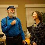 Kachemak Bay Campus Director Carol Swartz, right, smiles as Rep. Paul Seaton, NP-Homer, left, presents her with a Legislative Proclamation at her retirement party Lands End Resort on Friday, Dec. 14, 2018 in Homer, Alaska. Swartz ends her job as director at the end of the year. Friends joined her in celebrating her tenure as director of the local branch campus of Kenai Peninsula College, University of Alaska Anchorage. (Photo by Michael Armstrong/Homer News)