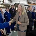 In this file photo, Rep. Cathy Munoz, R-Juneau, greets Airlift Northwest pilots Randy Aspeluind, left, and Tyler Cousins during a bill signing by Gov. Sean Parnell at the air ambulance companys hangar at the Juneau International Airport on Wednesday, April 23, 2014. (Michael Penn | Juneau Empire File)