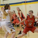 Kardinal Hayley Maw plays defense on Mariner Rylee Doughty during a game against the Homer Mariner girls basketball team on Friday, Dec. 21, 2018, in Homer, Alaska. (Photo by Michael Armstrong/Homer News)