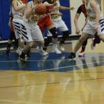 Mariner Marina Carroll dribbles the ball during a basketball game against the Kenai Kardinals on Friday, Dec. 21, 2018, at the Homer High School Alice Witte Gym in Homer, Alaska. (Photo by Michael Armstrong/Homer News)